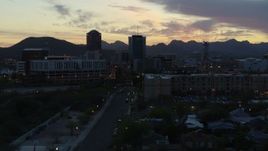 5.7K aerial stock footage low approach to office towers at sunset, seen from apartment buildings, Downtown Tucson, Arizona Aerial Stock Footage | DX0002_147_015