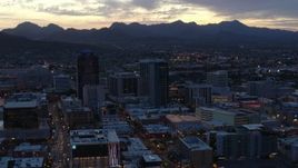 5.7K aerial stock footage reverse view and flyby tall office towers at sunset, Downtown Tucson, Arizona Aerial Stock Footage | DX0002_147_021