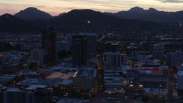 5.7K aerial stock footage slowly passing tall office towers at sunset, Downtown Tucson, Arizona Aerial Stock Footage | DX0002_147_023