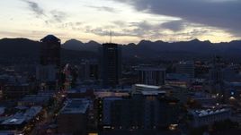 5.7K aerial stock footage descend while focused on tall office towers at sunset, Downtown Tucson, Arizona Aerial Stock Footage | DX0002_147_024