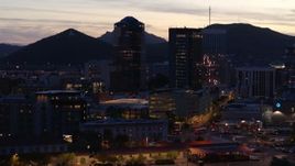5.7K aerial stock footage slowly orbit tall office towers at sunset, Downtown Tucson, Arizona Aerial Stock Footage | DX0002_147_025