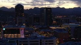 5.7K aerial stock footage orbit tall office towers and Congress Street at sunset, Downtown Tucson, Arizona Aerial Stock Footage | DX0002_147_028
