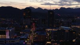 5.7K aerial stock footage orbit tall office towers and Congress Street at twilight, Downtown Tucson, Arizona Aerial Stock Footage | DX0002_147_031