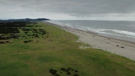 4K aerial stock footage of a wide view of people on the beach in Long Beach, Washington Aerial Stock Footage | DX0002_148_008