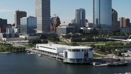 5.7K aerial stock footage of a reverse view of Discovery World museum in Downtown Milwaukee, Wisconsin Aerial Stock Footage | DX0002_149_012