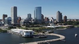 5.7K aerial stock footage of flying around the waterfront museum with a view of the city in Downtown Milwaukee, Wisconsin Aerial Stock Footage | DX0002_149_026