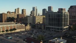 5.7K aerial stock footage of a student dormitory complex by parking lot at sunset in Downtown Milwaukee, Wisconsin Aerial Stock Footage | DX0002_150_010
