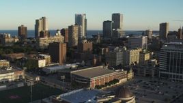 5.7K aerial stock footage of ascending for a view of the skyline at sunset in Downtown Milwaukee, Wisconsin Aerial Stock Footage | DX0002_150_013