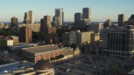 5.7K aerial stock footage of a view of the skyline while flying by dormitory building at sunset in Downtown Milwaukee, Wisconsin Aerial Stock Footage | DX0002_150_015