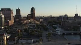 5.7K aerial stock footage tall office tower by the Milwaukee River at sunset, Downtown Milwaukee, Wisconsin Aerial Stock Footage | DX0002_150_025