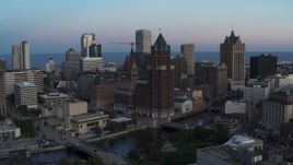 5.7K aerial stock footage of a riverfront office tower at twilight, Downtown Milwaukee, Wisconsin Aerial Stock Footage | DX0002_150_033