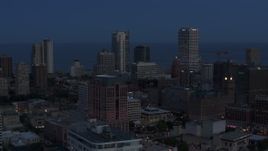 5.7K aerial stock footage a view of across the city of tall skyscrapers, Downtown Milwaukee, Wisconsin at twilight Aerial Stock Footage | DX0002_150_038