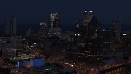 5.7K aerial stock footage of skyscrapers at night, seen while passing Milwaukee Center, Downtown Milwaukee, Wisconsin Aerial Stock Footage | DX0002_151_008