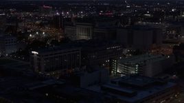 5.7K aerial stock footage of flying away from the Milwaukee County Circuit Court at night, Milwaukee, Wisconsin Aerial Stock Footage | DX0002_151_011