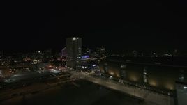 5.7K aerial stock footage of a high-rise apartment building at night, Downtown Milwaukee, Wisconsin Aerial Stock Footage | DX0002_151_012