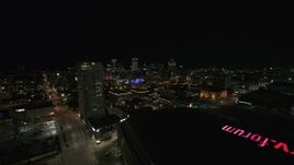 5.7K aerial stock footage reverse view of high-rise apartment building and skyline at night, Downtown Milwaukee, Wisconsin Aerial Stock Footage | DX0002_151_014
