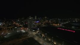 5.7K aerial stock footage approach high-rise apartment building and city skyline at night, Downtown Milwaukee, Wisconsin Aerial Stock Footage | DX0002_151_015