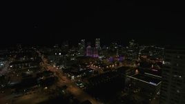 5.7K aerial stock footage fly away from the city's skyline, reveal apartment high-rise at night, Downtown Milwaukee, Wisconsin Aerial Stock Footage | DX0002_151_022
