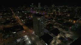 5.7K aerial stock footage approach and orbit an apartment high-rise at night, Downtown Milwaukee, Wisconsin Aerial Stock Footage | DX0002_151_023