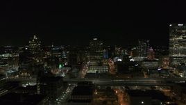 5.7K aerial stock footage of a stationary view of downtown buildings at night, Downtown Milwaukee, Wisconsin Aerial Stock Footage | DX0002_151_027