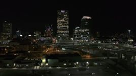 5.7K aerial stock footage of US Bank Center skyscraper seen during descent at night, Downtown Milwaukee, Wisconsin Aerial Stock Footage | DX0002_151_037