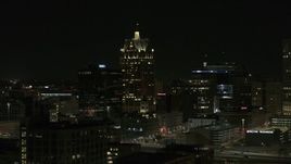 5.7K aerial stock footage wide orbit of a skyscraper in Downtown Milwaukee, Wisconsin at night Aerial Stock Footage | DX0002_151_039