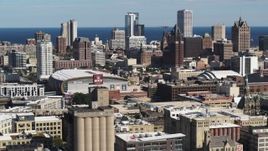 5.7K aerial stock footage wide view of the city's skyline in Downtown Milwaukee, Wisconsin, seen from industrial buildings Aerial Stock Footage | DX0002_152_014