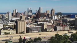 5.7K aerial stock footage wide view of the city's skyline in Downtown Milwaukee, Wisconsin, seen from I-43 Aerial Stock Footage | DX0002_152_021