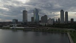 5.7K aerial stock footage reverse view of skyscrapers and art museum from Lake Michigan in Downtown Milwaukee, Wisconsin Aerial Stock Footage | DX0002_154_003