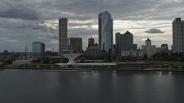 5.7K aerial stock footage stationary view of city's waterfront museum and skyline from Lake Michigan in Downtown Milwaukee, Wisconsin Aerial Stock Footage | DX0002_154_017