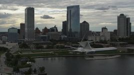 5.7K aerial stock footage of passing by tall skyscrapers and a museum, Downtown Milwaukee, Wisconsin Aerial Stock Footage | DX0002_154_022