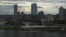 5.7K aerial stock footage flying away from tall skyscrapers and a museum, Downtown Milwaukee, Wisconsin Aerial Stock Footage | DX0002_154_023