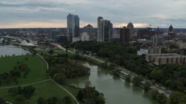 5.7K aerial stock footage of a reverse view of the skyline from Veterans Park, Downtown Milwaukee, Wisconsin Aerial Stock Footage | DX0002_154_030