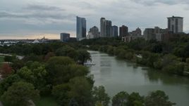 5.7K aerial stock footage of the city's skyline, seen while flying low over Veterans Park, Downtown Milwaukee, Wisconsin Aerial Stock Footage | DX0002_154_034