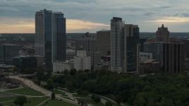 5.7K aerial stock footage flying away from the city's skyline at sunset, Downtown Milwaukee, Wisconsin Aerial Stock Footage | DX0002_155_008