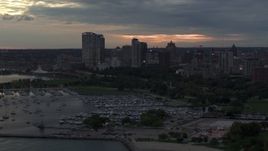 5.7K aerial stock footage stationary view of the city's skyline, seen from the marina at twilight, Downtown Milwaukee, Wisconsin Aerial Stock Footage | DX0002_155_026