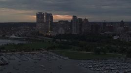 5.7K aerial stock footage a stationary view of the city's skyline at twilight from over the marina, Downtown Milwaukee, Wisconsin Aerial Stock Footage | DX0002_155_032