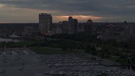 5.7K aerial stock footage pass and fly away from the city's skyline at twilight, Downtown Milwaukee, Wisconsin Aerial Stock Footage | DX0002_155_034