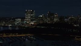 5.7K aerial stock footage ascend over the marina with a view of the city's skyline at night, Downtown Milwaukee, Wisconsin Aerial Stock Footage | DX0002_155_038