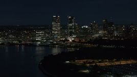 5.7K aerial stock footage of a view of the city's skyline from the marina at night, Downtown Milwaukee, Wisconsin Aerial Stock Footage | DX0002_155_039