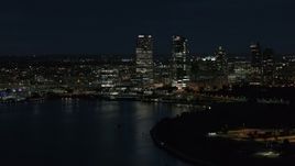 5.7K aerial stock footage of a view of the city's skyline while flying near the marina at night, Downtown Milwaukee, Wisconsin Aerial Stock Footage | DX0002_155_040