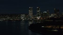 5.7K aerial stock footage of the city's skyline while flying near the marina at night, Downtown Milwaukee, Wisconsin Aerial Stock Footage | DX0002_155_041