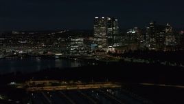 5.7K aerial stock footage fly above the marina while focused on the city's skyline at night, Downtown Milwaukee, Wisconsin Aerial Stock Footage | DX0002_155_043