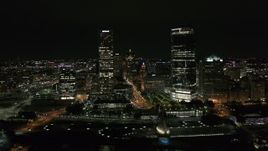 5.7K aerial stock footage of flying by tall skyscrapers at night, Downtown Milwaukee, Wisconsin Aerial Stock Footage | DX0002_157_002