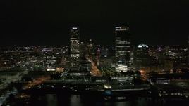 5.7K aerial stock footage of flying away from towering skyscrapers at night, Downtown Milwaukee, Wisconsin Aerial Stock Footage | DX0002_157_006