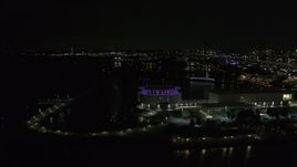 5.7K aerial stock footage fly away from Discovery World museum at night, Downtown Milwaukee, Wisconsin Aerial Stock Footage | DX0002_157_011
