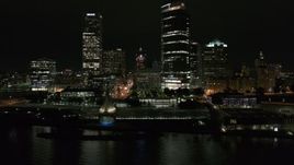 5.7K aerial stock footage fly away from the lakefront museum near skyscrapers at night, Downtown Milwaukee, Wisconsin Aerial Stock Footage | DX0002_157_020