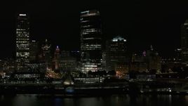5.7K aerial stock footage of a wide orbit of a towering skyscraper at night, Downtown Milwaukee, Wisconsin Aerial Stock Footage | DX0002_157_034