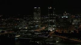 5.7K aerial stock footage fly away from a pair of towering skyscrapers at night, Downtown Milwaukee, Wisconsin Aerial Stock Footage | DX0002_157_038