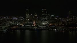 5.7K aerial stock footage of towering skyscrapers seen from the lake at night, Downtown Milwaukee, Wisconsin Aerial Stock Footage | DX0002_157_040